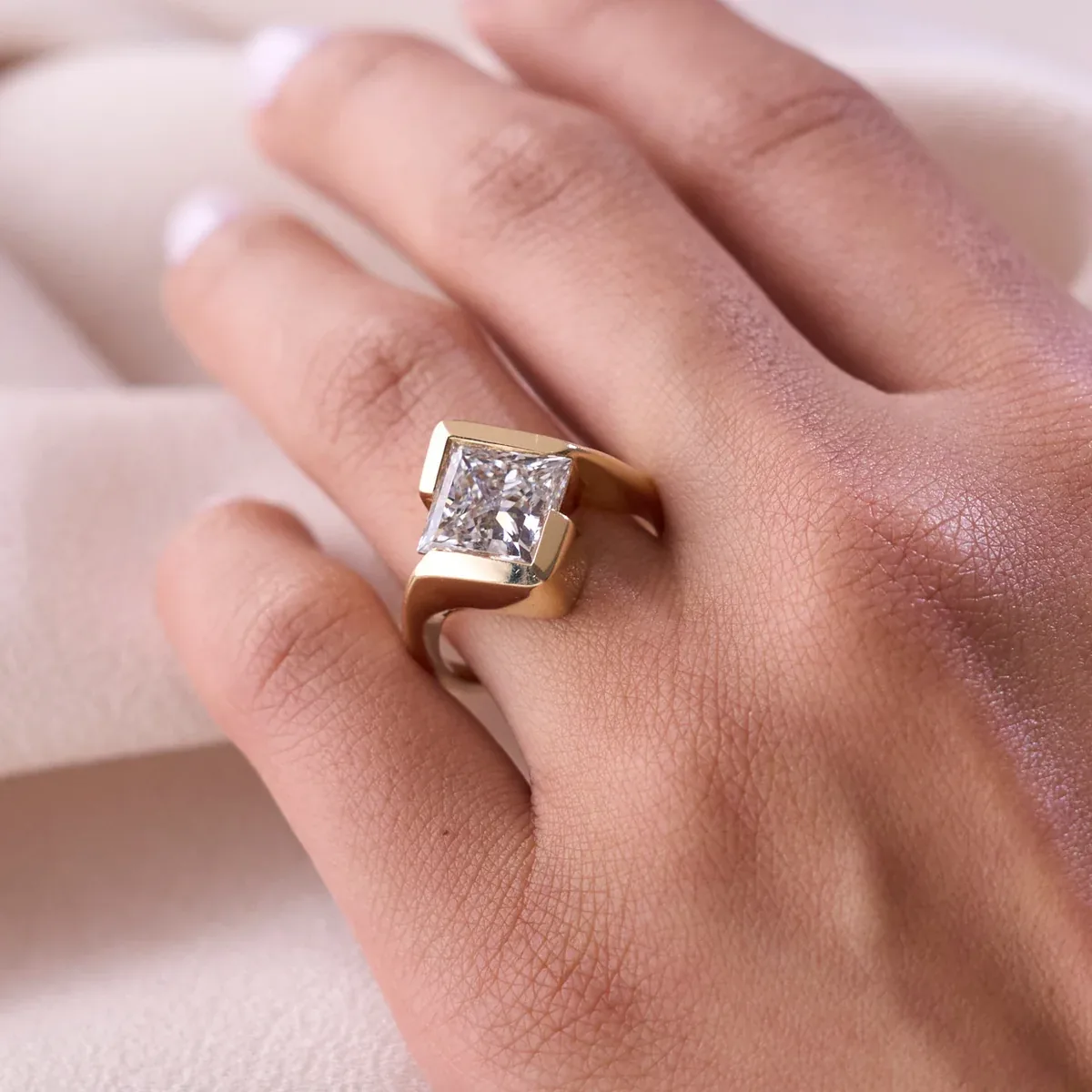 Princess half-bezel ring modeled on a hand